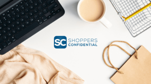 An image of a Computer, A Bag, A Coffee, Notes, and A Scarf With The Shoppers Confidential Logo