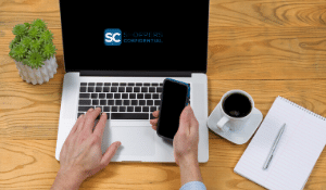 A-Computer-And-Cell-Phone-With-Shoppers-Confidential-logo